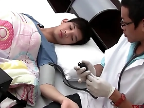 Gay couple watches as an Asian twink is examined and fucked by a doctor.