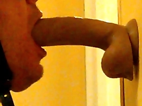 Deep throat action with a dildo in gay porn