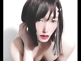 Cross dressing Japanese beauty in female attire