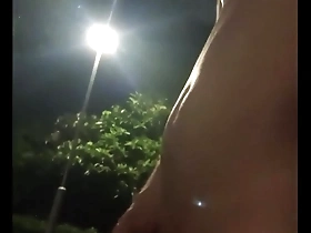 Public park walk in the nude of an Asian woman