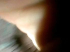 A young gay man enjoys anal play with a dildo alone.