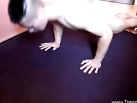 A muscular Asian man posing and flexing his muscles.