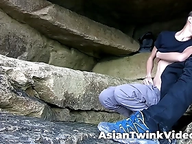 Young gay couple enjoys hot interracial sex in the natural environment of a cave.