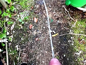 Solo boy urinates in the garden outdoors on 10th April 2021