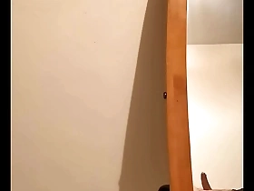 A chubby gay man masturbates in front of a hidden camera.