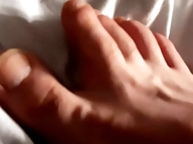 Young gay man enjoys foot fetish