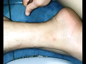 A solo boy gives a massage with oil to himself.