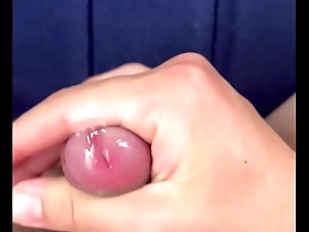 Young Japanese man masturbates in slow motion.
