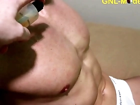 Muscular Asian man gets a sensual massage with nipple and muscle focus.