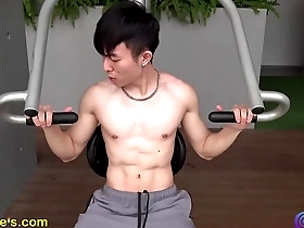 Fitness enthusiast shows off his well-toned body and muscles outdoors.