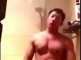 Asian man performing solo on webcam