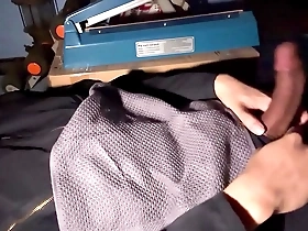 A solo pleasure moment from a mechanic while he is working on a bicycle.