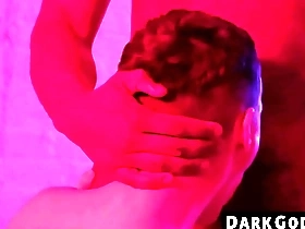 A skinny gay guy gets dominated by a black man in an interracial scene at DarkGodz.com.